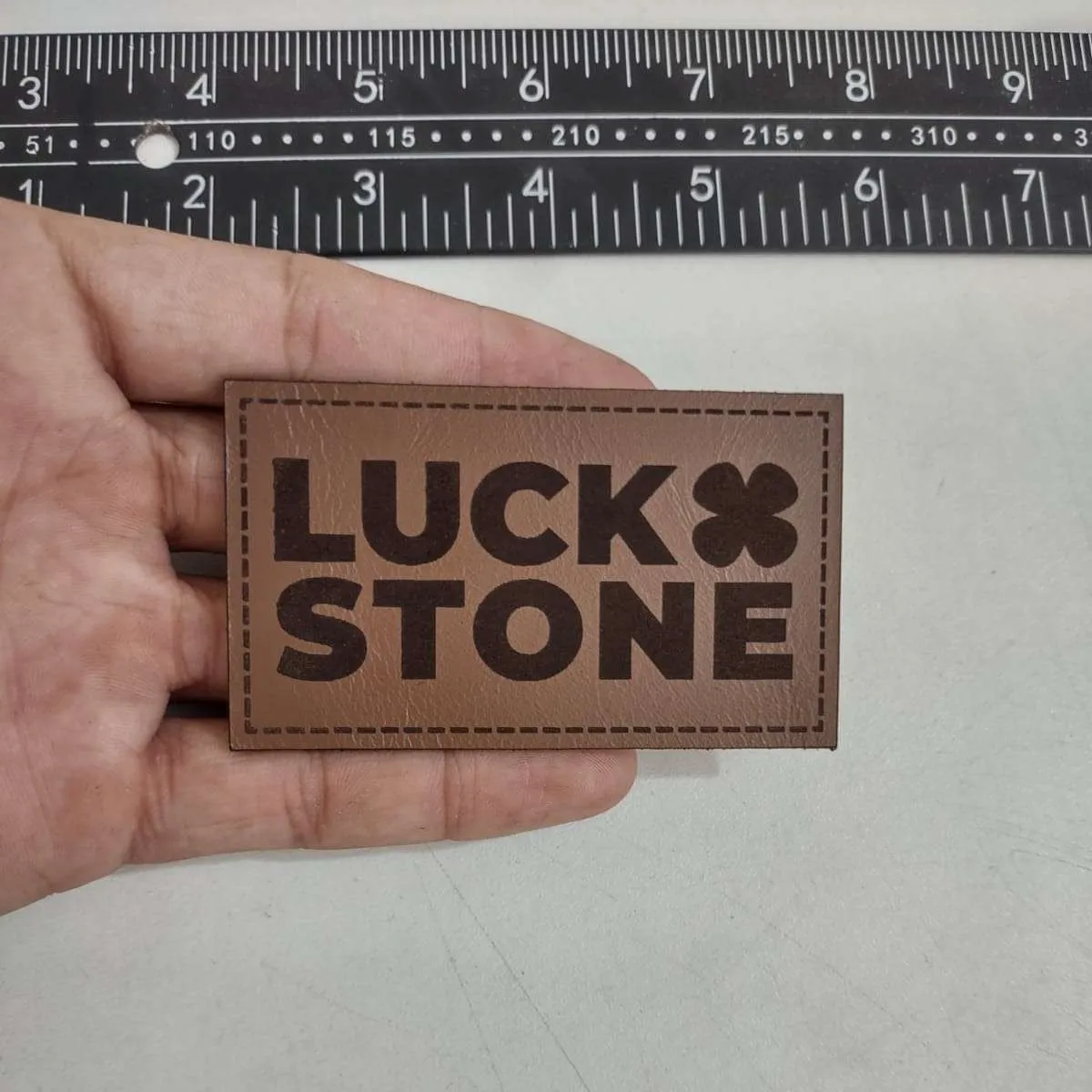 Premium leather patch with embossed logo design - Example 5 by Dynamic Digitizers USA